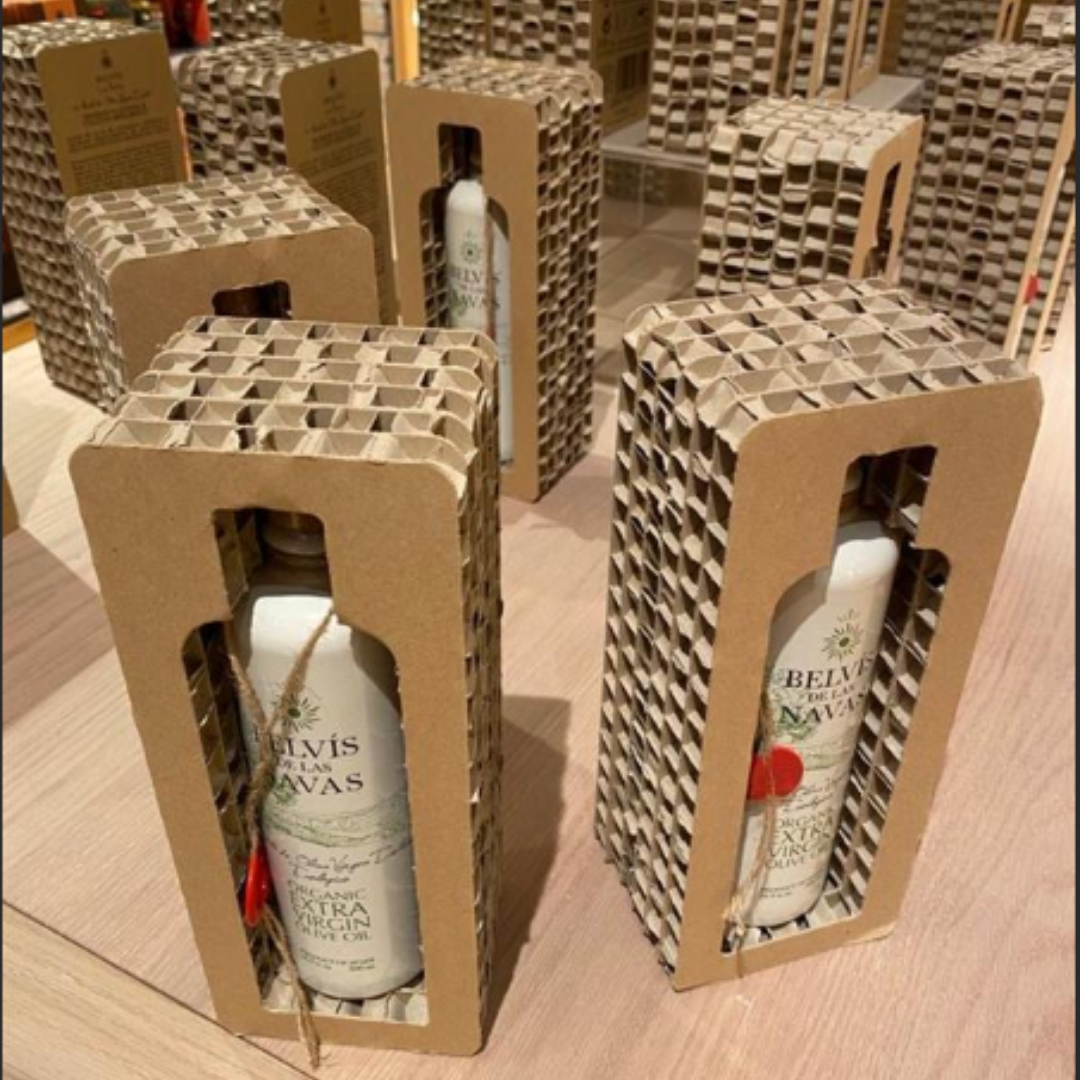 Eco-friendly honeycomb cardboard inserts protecting glass bottles during shipping