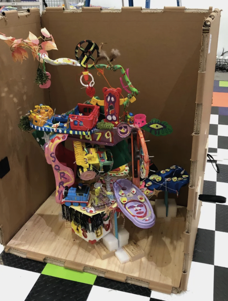 Large, brightly coloured art installation housed in a durable Rebul honeycomb crate, demonstrating lightweight and impact-resistant packaging design.