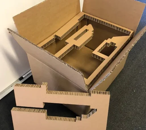 Die-cut internal support packaging for luxury items, offering structured protection with environmentally friendly materials.